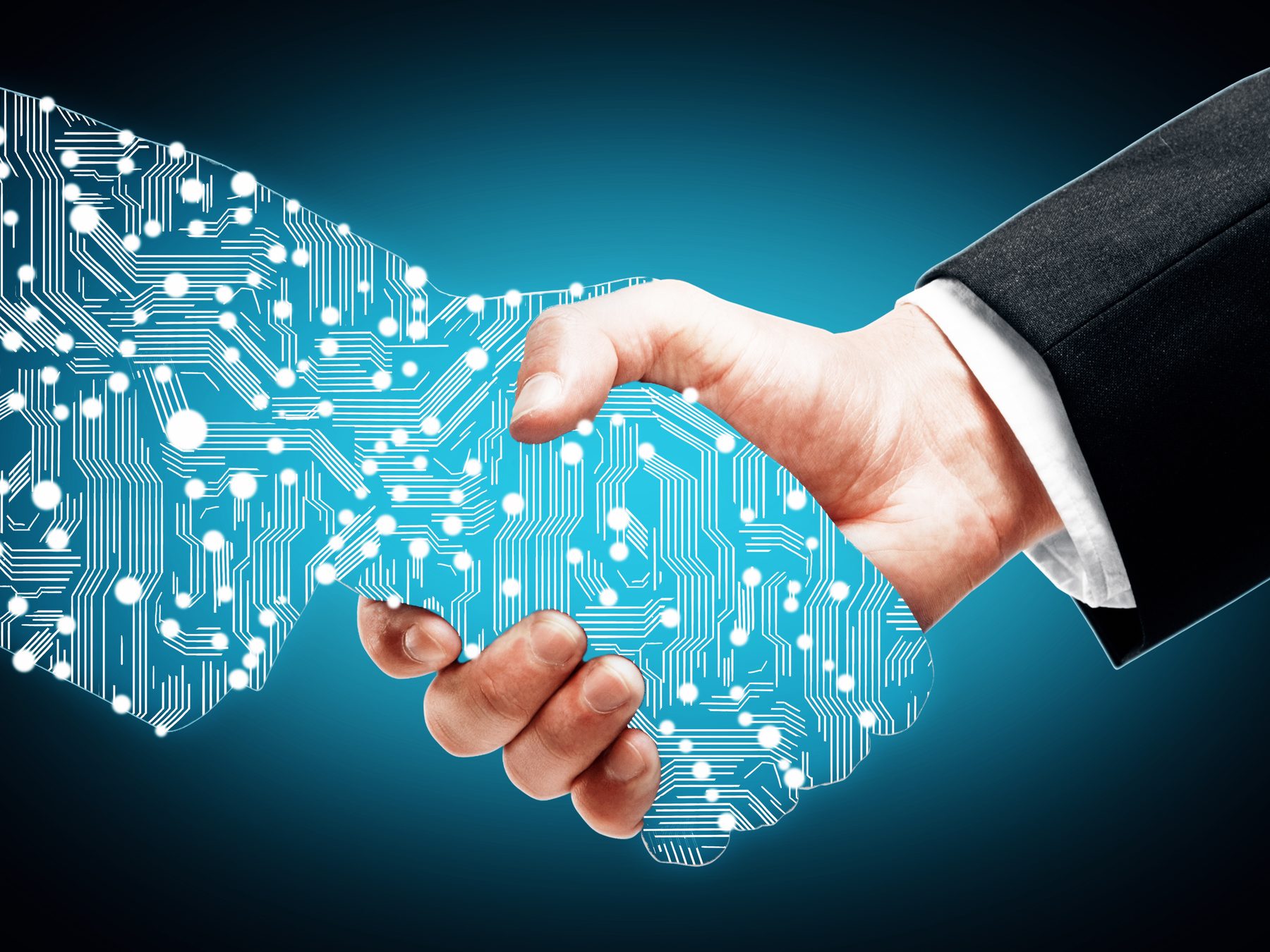 A handshake between a human hand and a digital hand seals the direct deal.